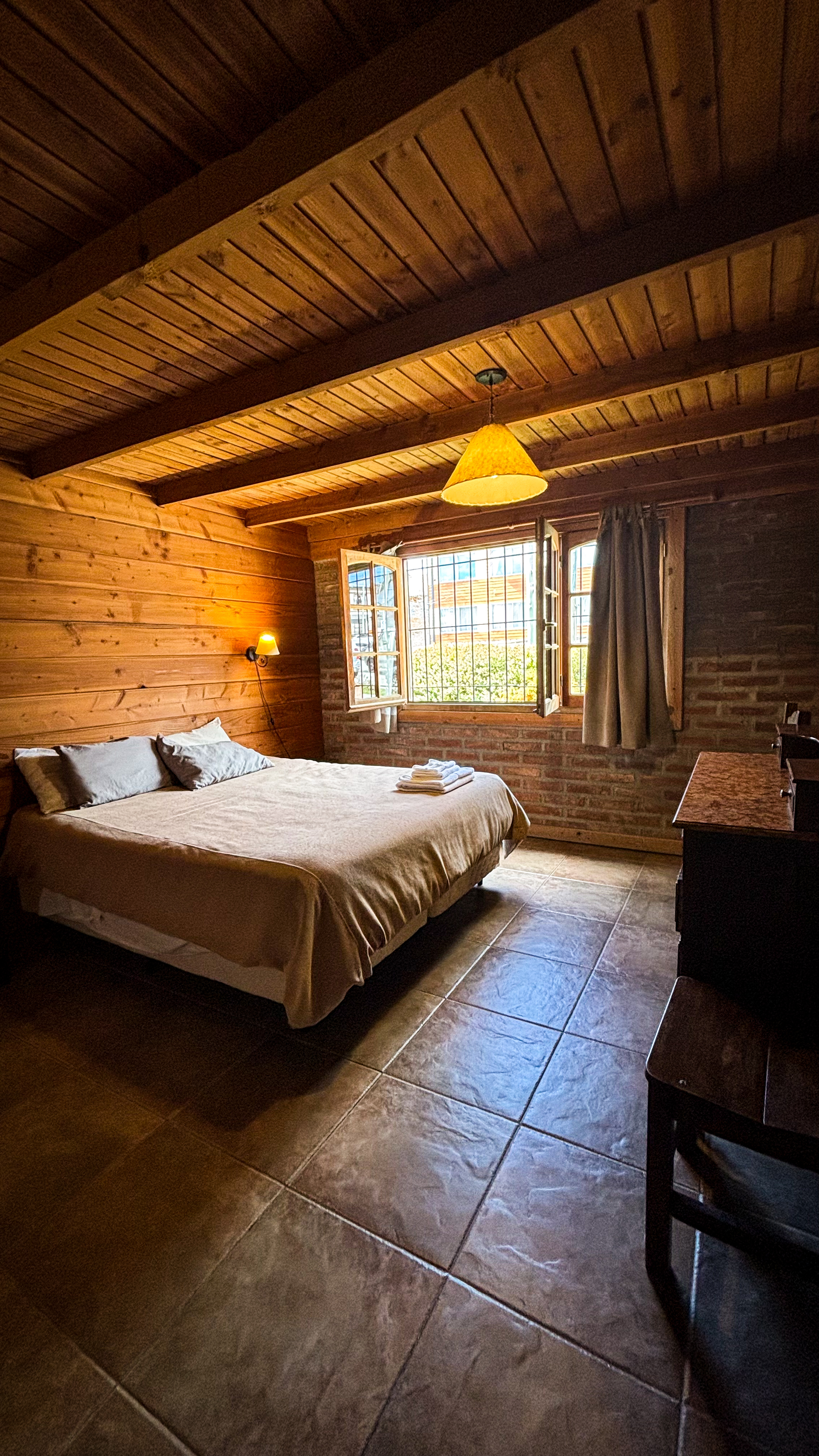 Private room with exposed beams and mountain views