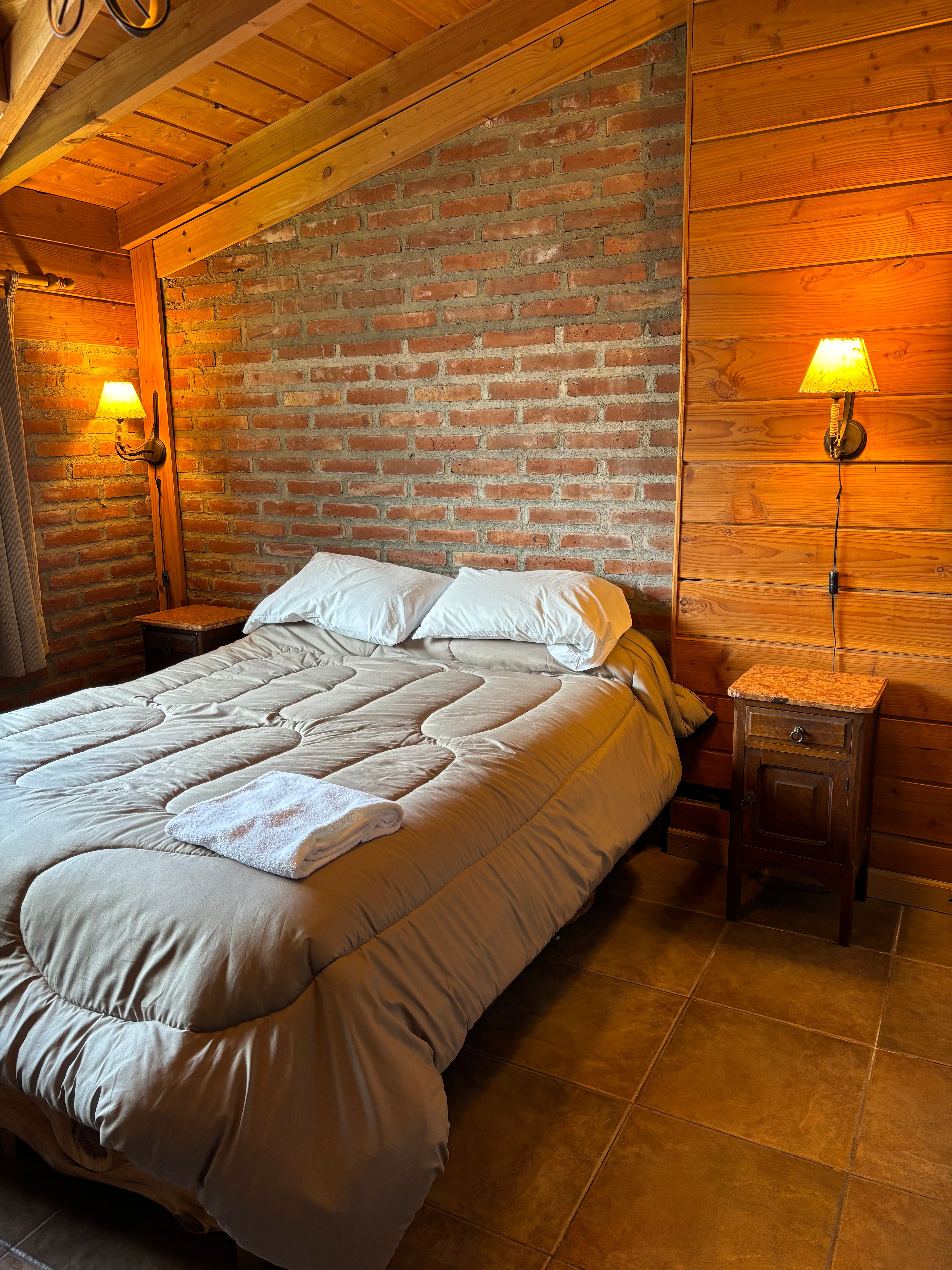 Cozy private room with rustic brick walls